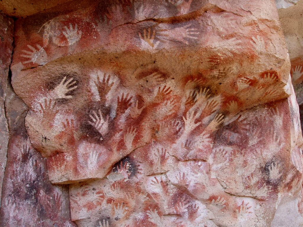 Cave art at Cueva de las Manos, Perito Moreno, Argentina. The art in the cave is dated between 13,000 and 9,000 BP by UNESCO; stenciled, mostly left hands are shown.