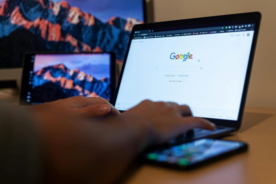 Close-Up Shot of a Person Using a Laptop to search Google for SEO
