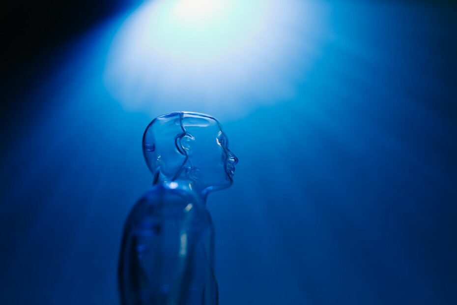 Shining light on a Clear Mannequin personification of GEO with a Dark Blue Background
